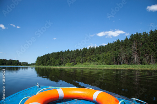 motorboat with buoy on blue lake photo