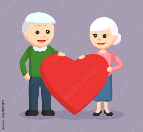 elderly couple holding big love