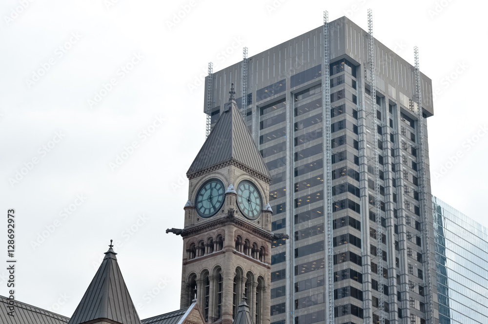 Old city hall  clock tower and skyscraper in Toronto downtown
