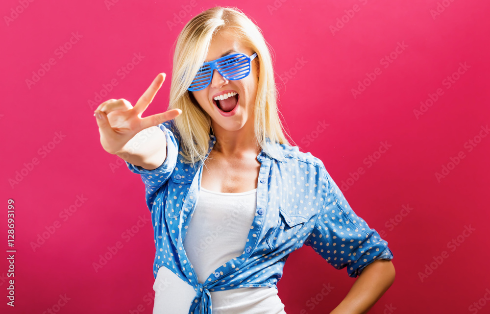 Young woman wearing shutter shades sunglasses Young woman wearing shutter shades sunglasses