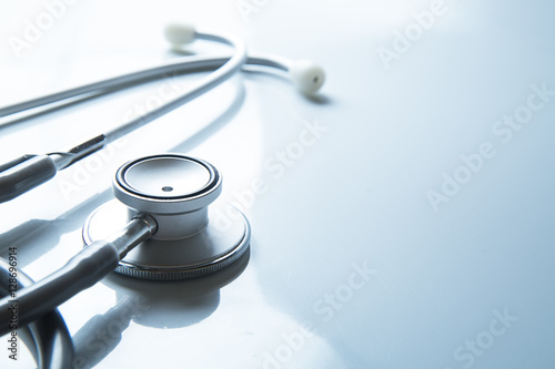 Stethoscope on blue background photo