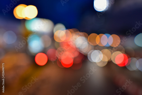 Night city street colorful lights bokeh background, Abstract bokeh from car light on the traffic road.