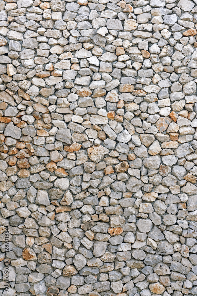 Gray and brown wall with stone masonry, background, texture Gray and brown wall with stone masonry, background, texture