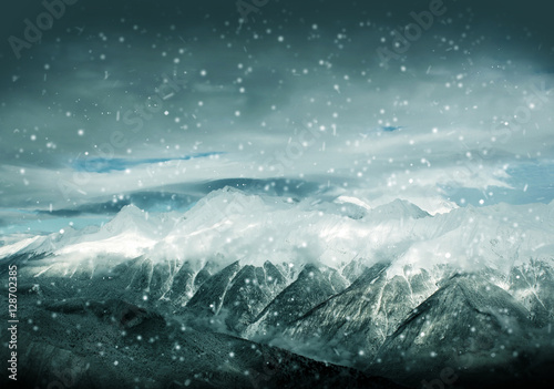 Winter landscape, hight mountains and storm clouds