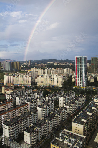 view over chinese city with rainbow