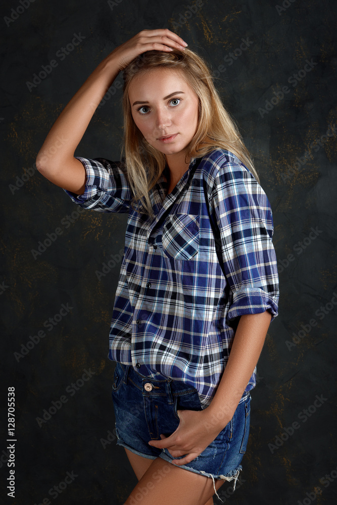 Test shots of fashion model in jeans shorts and shirt with no ma Test shots of fashion model in jeans shorts and shirt with no ma