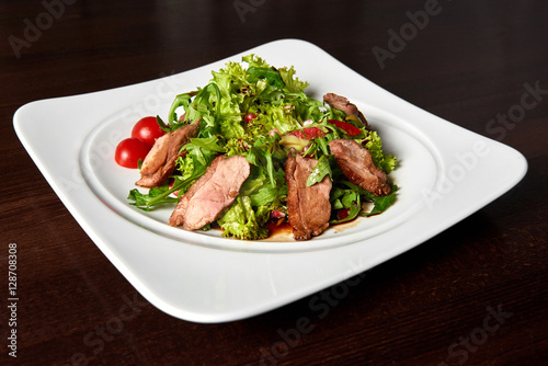 Grilled beef steak with green salad