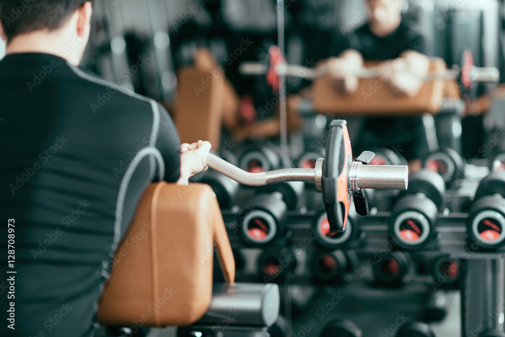Man working out with barbell weights Man working out with barbell weights
