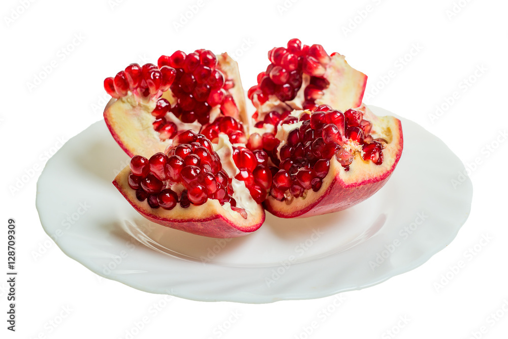 Pomegranate slices and garnet fruit seeds on table. Pomegranate whole. Useful fruit.