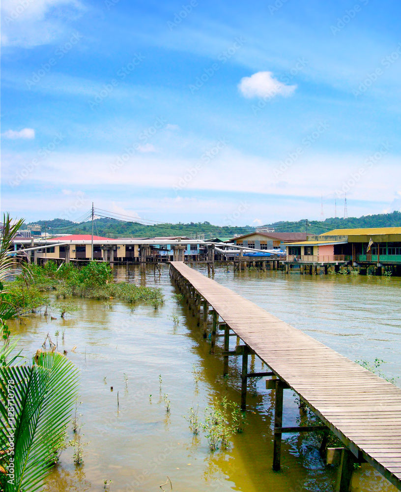 Fishing village in Brunei, with long footbridge over water. 