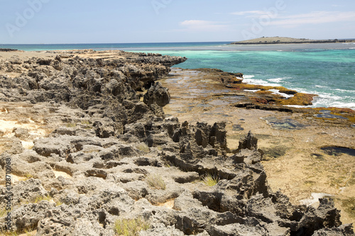 Bay Amoronia Indian Ocean, Orange cove is lined with sharp rocks, north of Madagascar photo