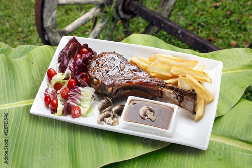 Prime rib with fries and salad photo