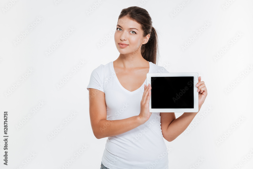 Woman holding digital tablet and showing the display Woman holding digital tablet and showing the display