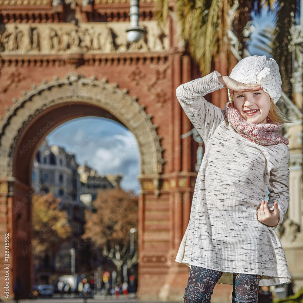 girl near Arc de Triomf in Barcelona looking into distance