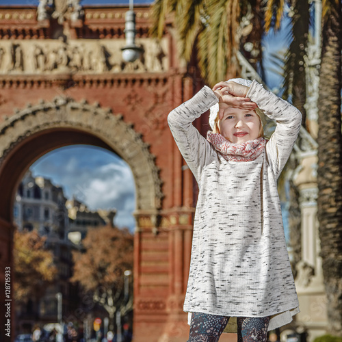 smiling trendy child in Barcelona, Spain standing photo