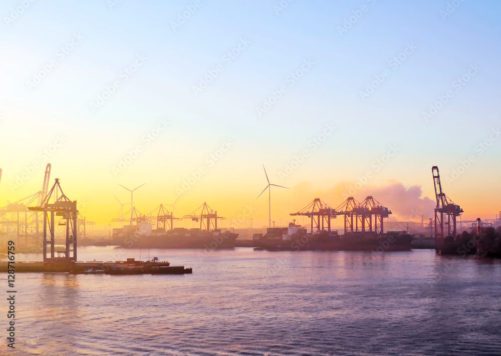 Harbor cranes in the sunset or sundown, freight shipping or container harbor scene. Harbor cranes in the sunset or sundown, freight shipping or container harbor scene.