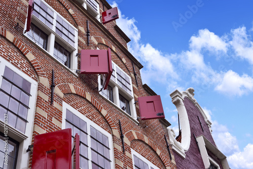 Dutch houses. View to historic facades of cobblestone and stucco.