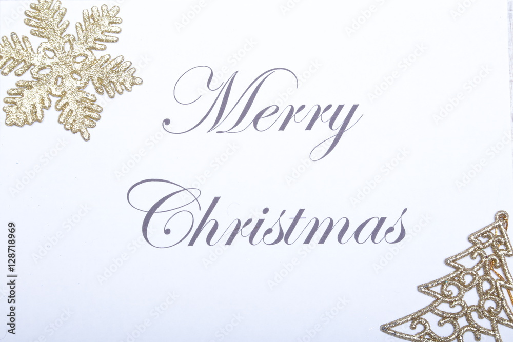 Text merry christmas on paper with gold decoration Text merry christmas on paper with gold decoration