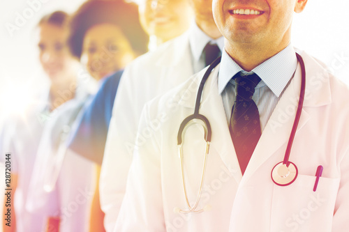 close up of happy doctors with stethoscope photo