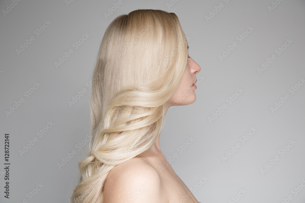 Portrait Of A Beautiful Young Blond Woman With Long Wavy Hair. Portrait Of A Beautiful Young Blond Woman With Long Wavy Hair.
