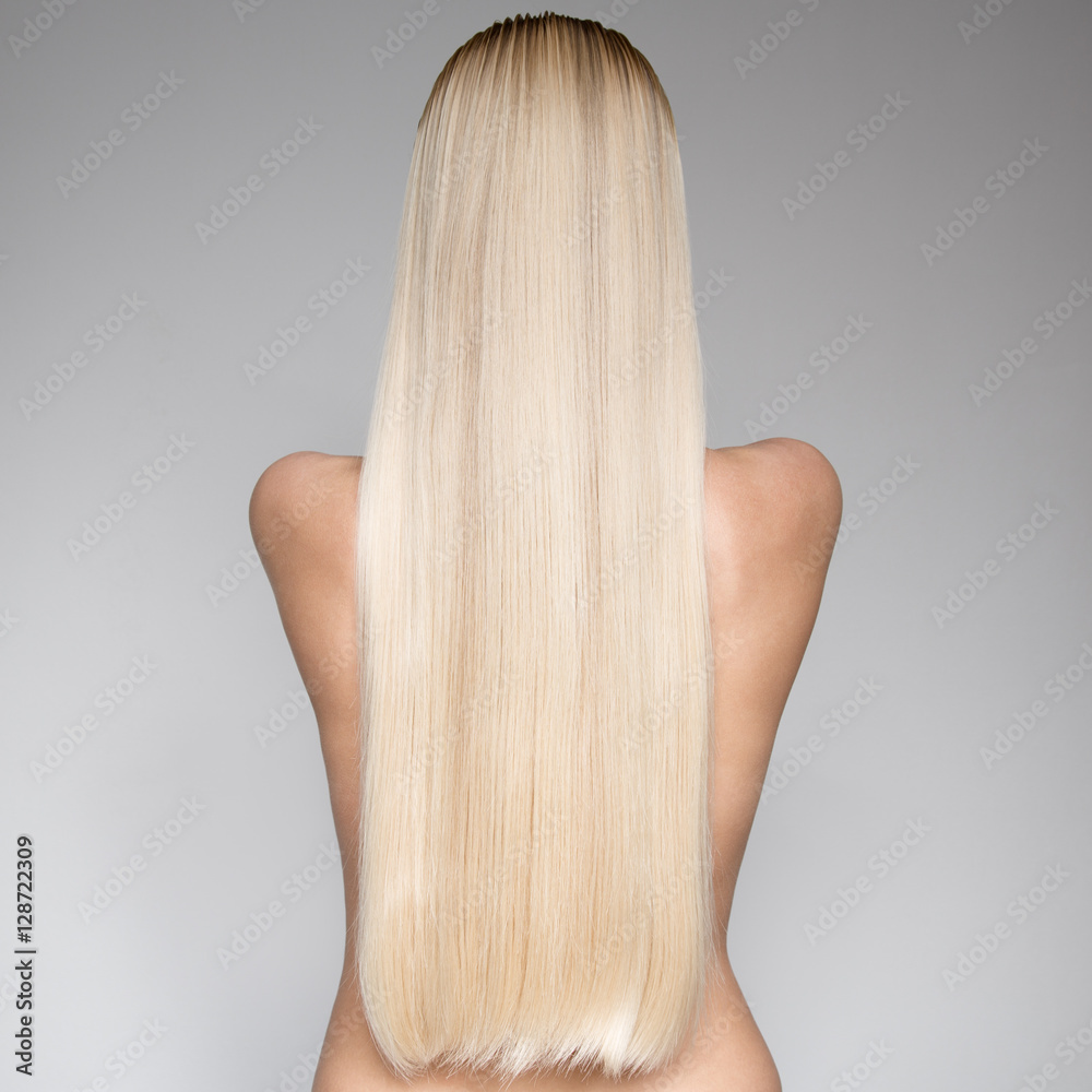 Naklejka premium Portrait Of A Beautiful Young Blond Woman With Long Hair