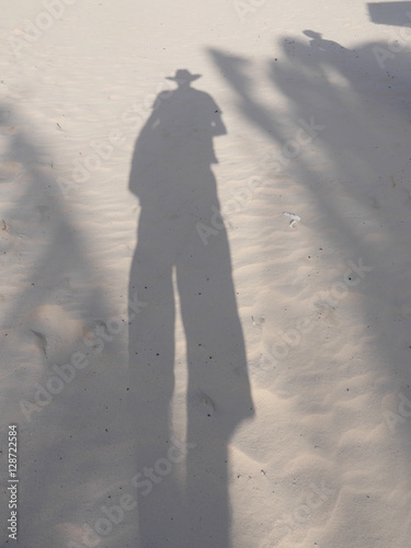 shadow of a man in the sand