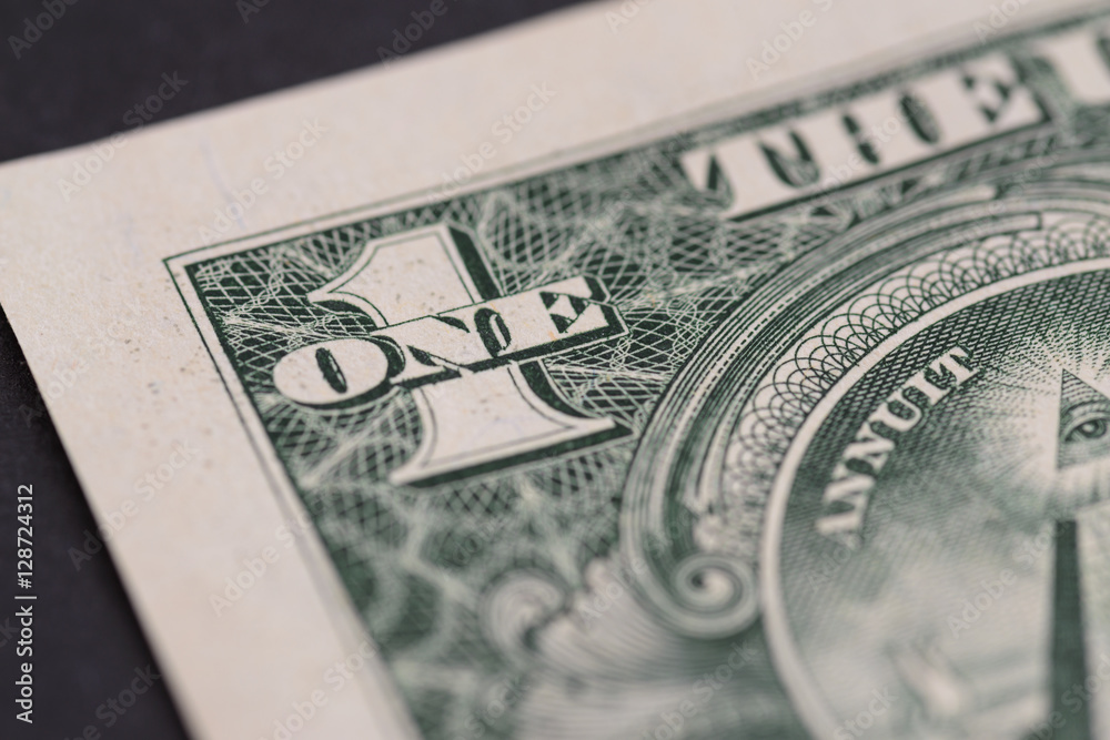 US one dollar, detail view. Macro with selective focus and shallow depth of field. US one dollar, detail view. Macro with selective focus and shallow depth of field.