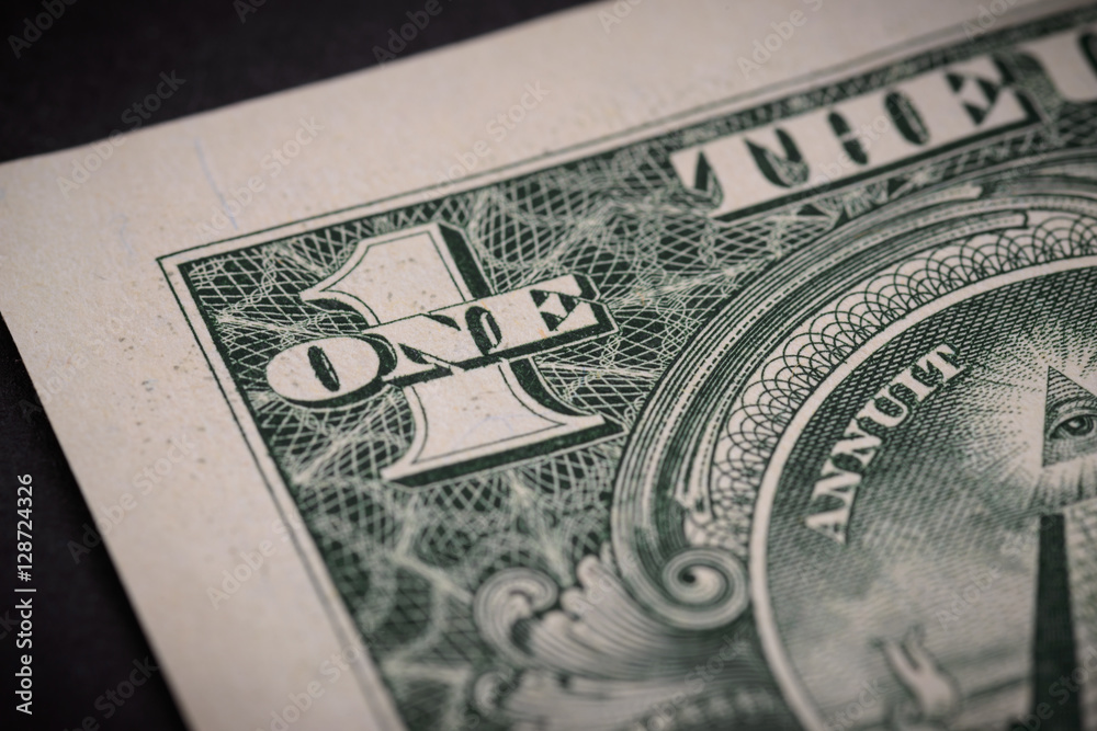 US one dollar, detail view. Macro with selective focus and shallow depth of field. US one dollar, detail view. Macro with selective focus and shallow depth of field.