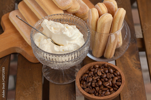 Cooking Tiramisu concept step by step. Homemade tiramisu cake. Ingredients for making perfect Italian dessert.