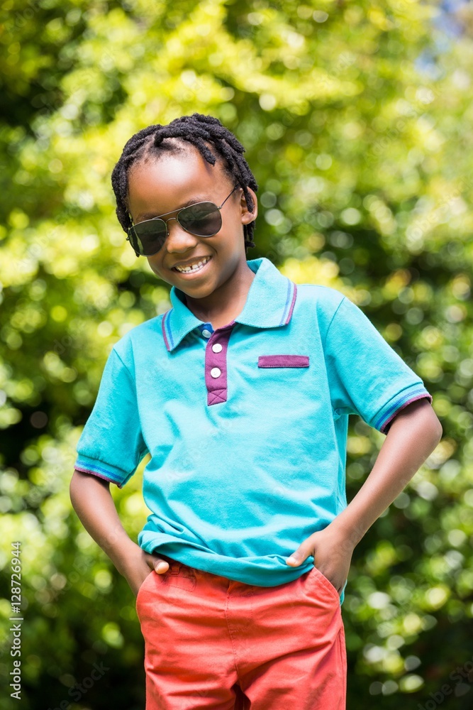 Fototapeta premium Smiling boy wearing sunglasses