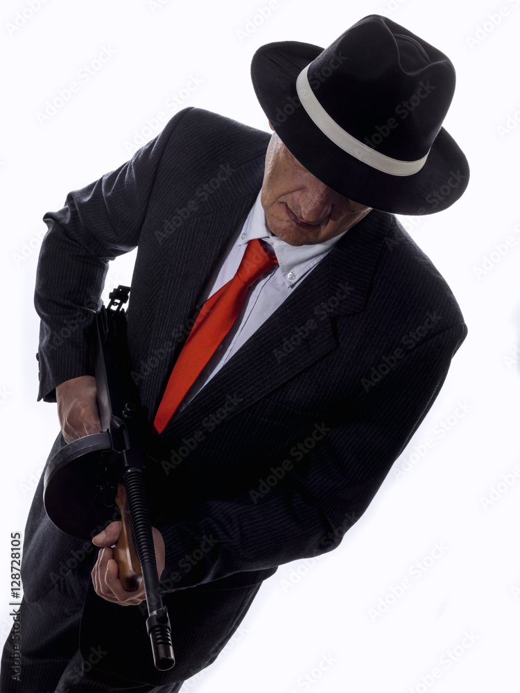 Old style gangster with tommy gun, on white background Old style gangster with tommy gun, on white background