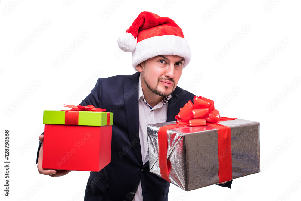 Happy handsome business man in christmas hat with gifts box in hands over white backgrounds Happy handsome business man in christmas hat with gifts box in hands over white backgrounds