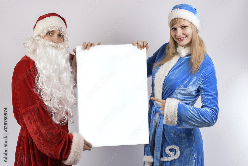 man with a girl in Christmas costumes man with a girl in Christmas costumes