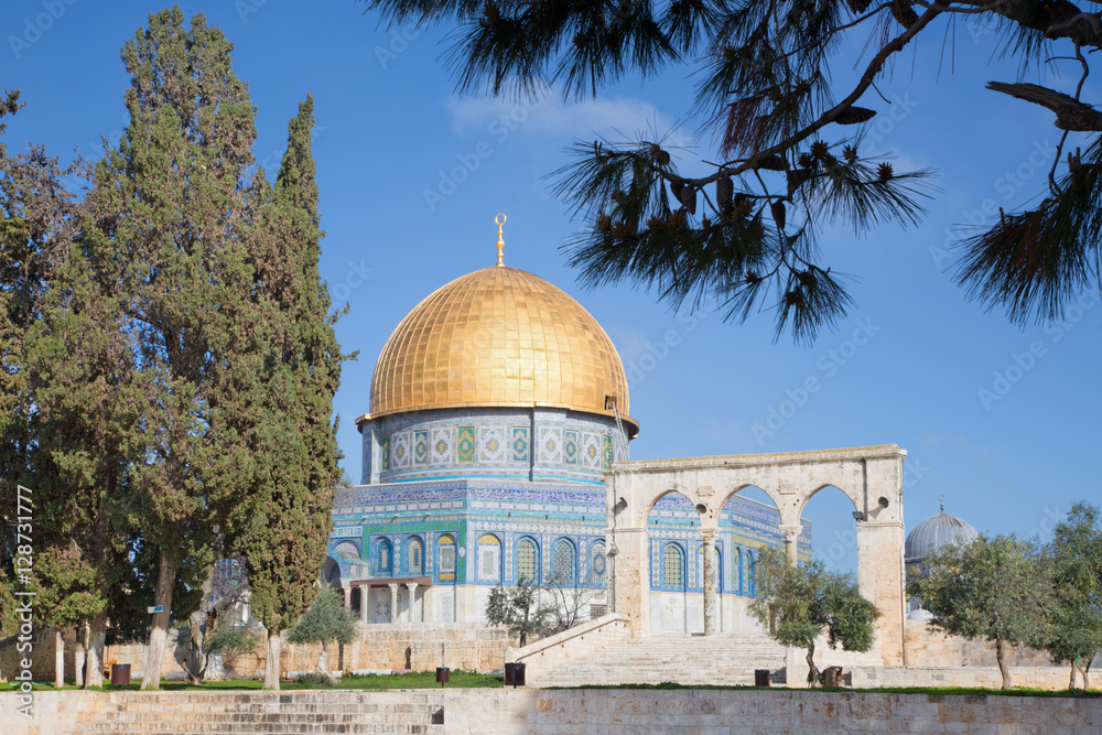 JERUSALEM, ISRAEL - MARCH 5, 2015: The Dom of Rock on the Temple Mount in the Old City. Dome was constructed by the order of Umayyad Caliph Abd al-Malik (689 and 691) and tiled by sultan Suleiman.