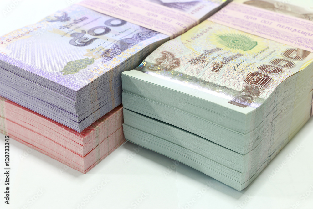 Thai currency on White background ,Stack of thai baht Thai currency on White background ,Stack of thai baht