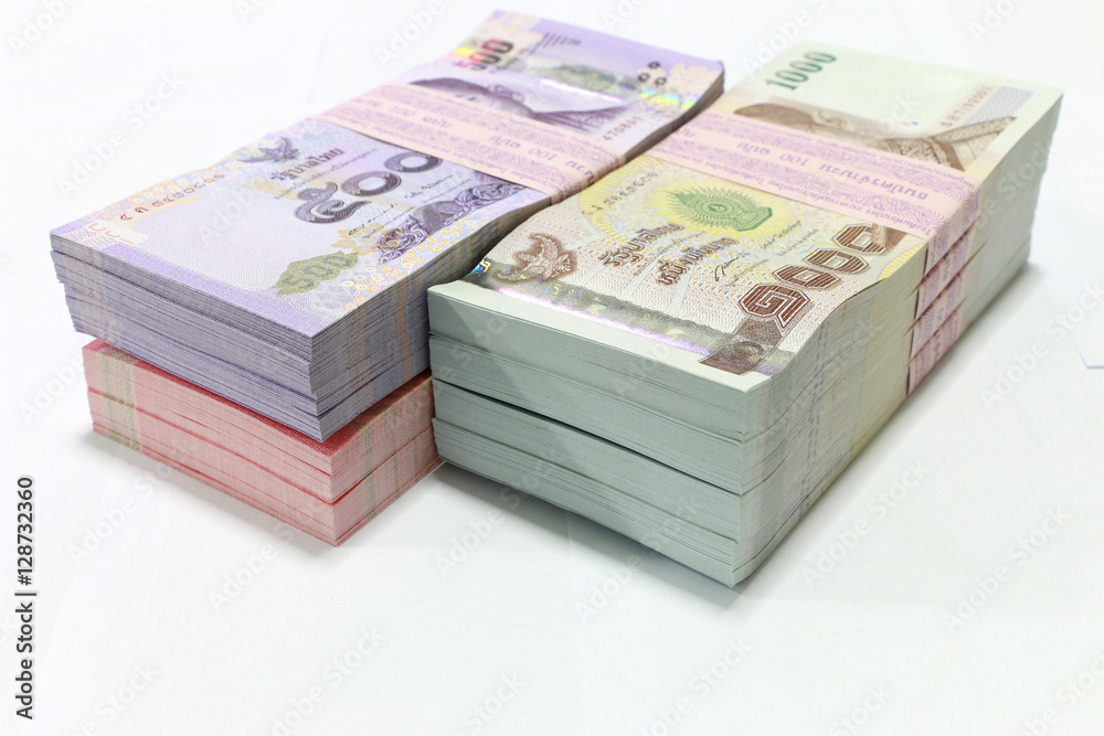 Thai currency on White background ,Stack of thai baht Thai currency on White background ,Stack of thai baht