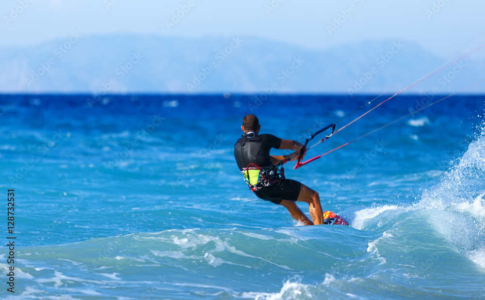 Kitesurfing, Kiteboarding action photos, man among waves quickly rides