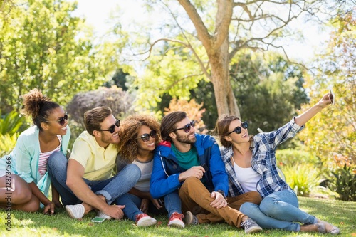 Group of friends taking a selfie with the mobile phone