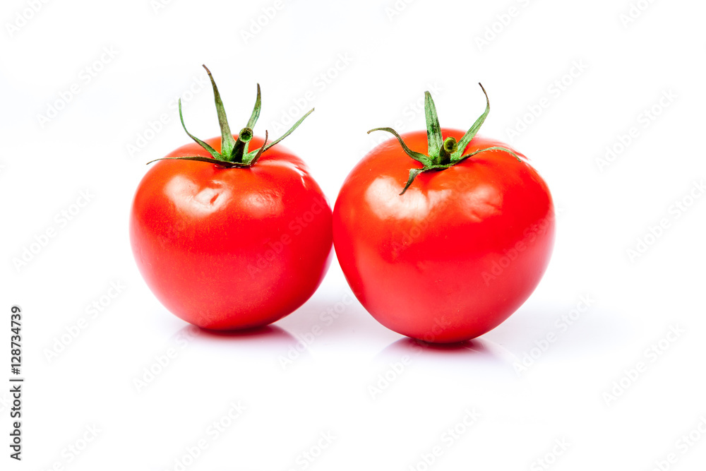 Two tomatoes isolated on a white background Two tomatoes isolated on a white background