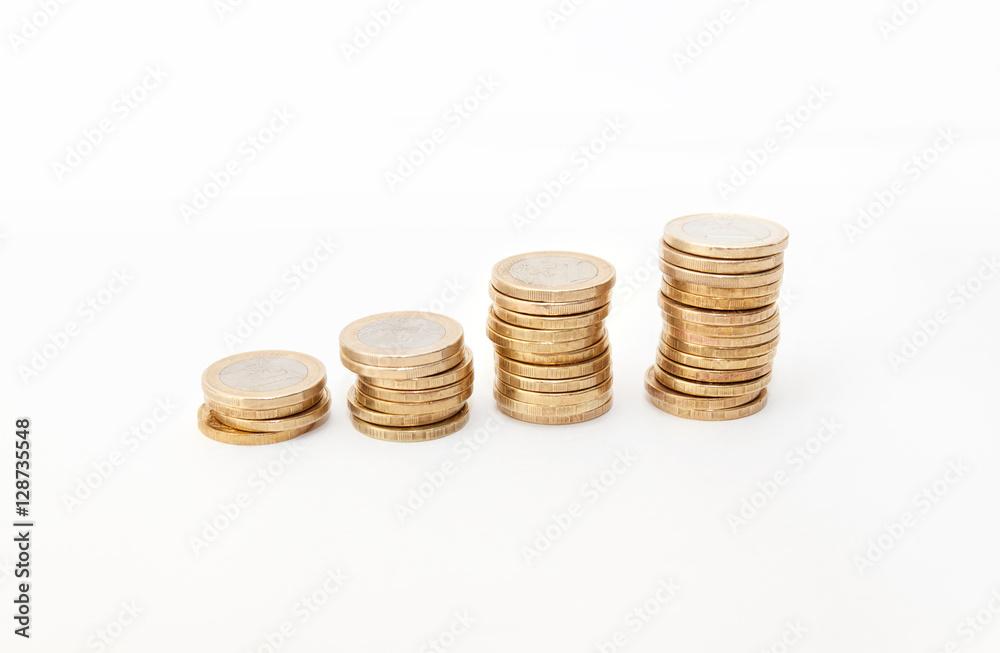 Economics growth concept - profit goes up. Euro coins on white background Economics growth concept - profit goes up. Euro coins on white background