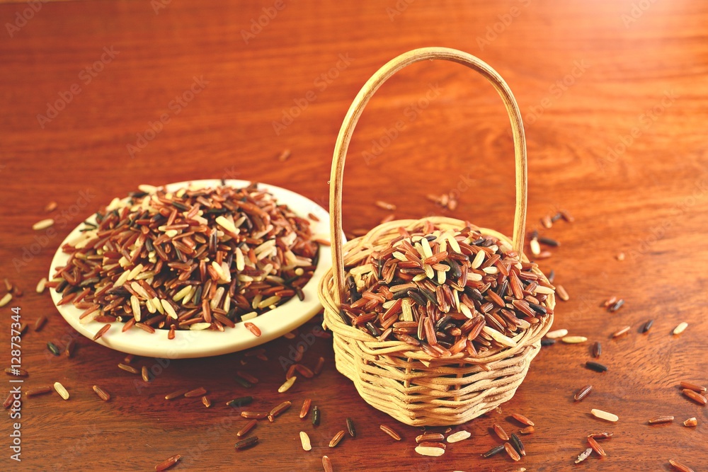 Riceberry / Organic Riceberry from Thailand in the basket and plate on the wooden floor.
Riceberry / Organic Riceberry from Thailand in the basket and plate on the wooden floor.
