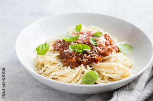 Spaghetti pasta with bolognese sauce and parmesan cheese