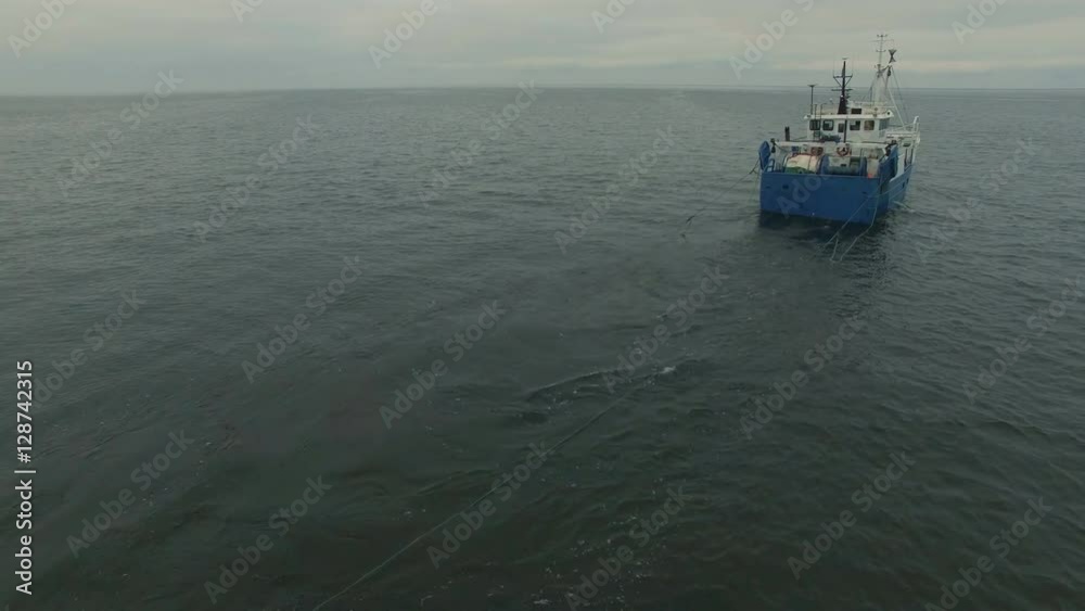 Aerial Shot of a Commercial Fishing Ship that Pulls Trawl Net. Shot on RED Cinema Camera in 4K (UHD). Aerial Shot of a Commercial Fishing Ship that Pulls Trawl Net. Shot on RED Cinema Camera in 4K (UHD).
