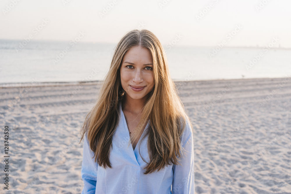 Portrait of smiling young woman on the beach Portrait of smiling young woman on the beach
