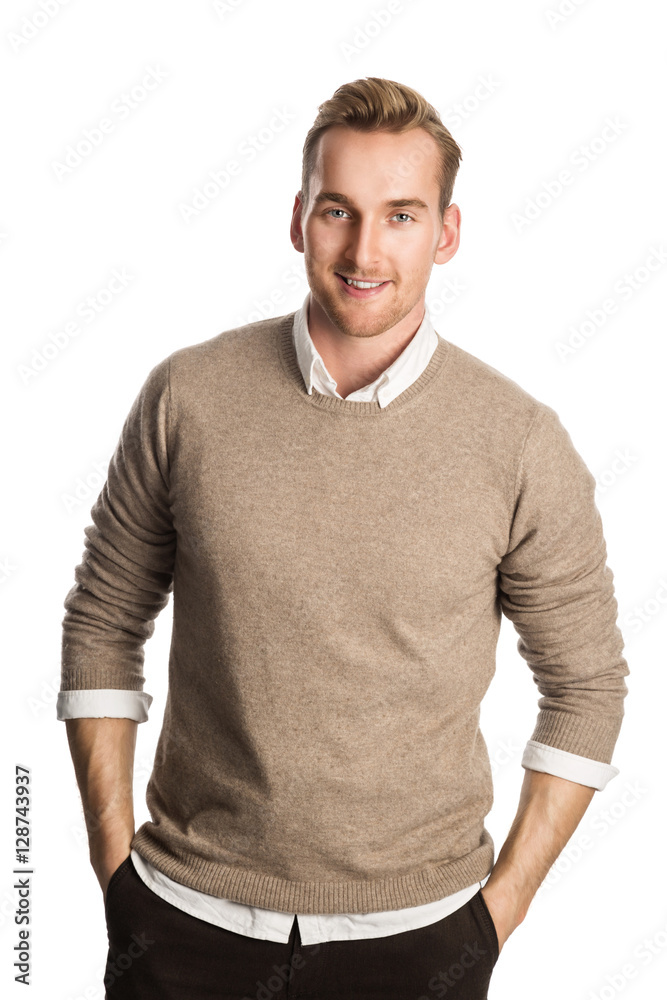 Handsome blonde man wearing a brown pullover and white shirt, standing