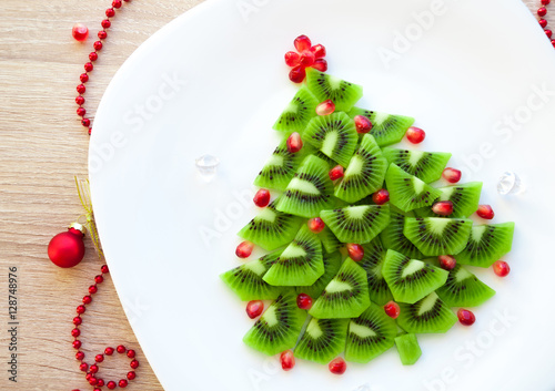 Kiwi Christmas tree - fun food idea for kids party or breakfast, New Year food background