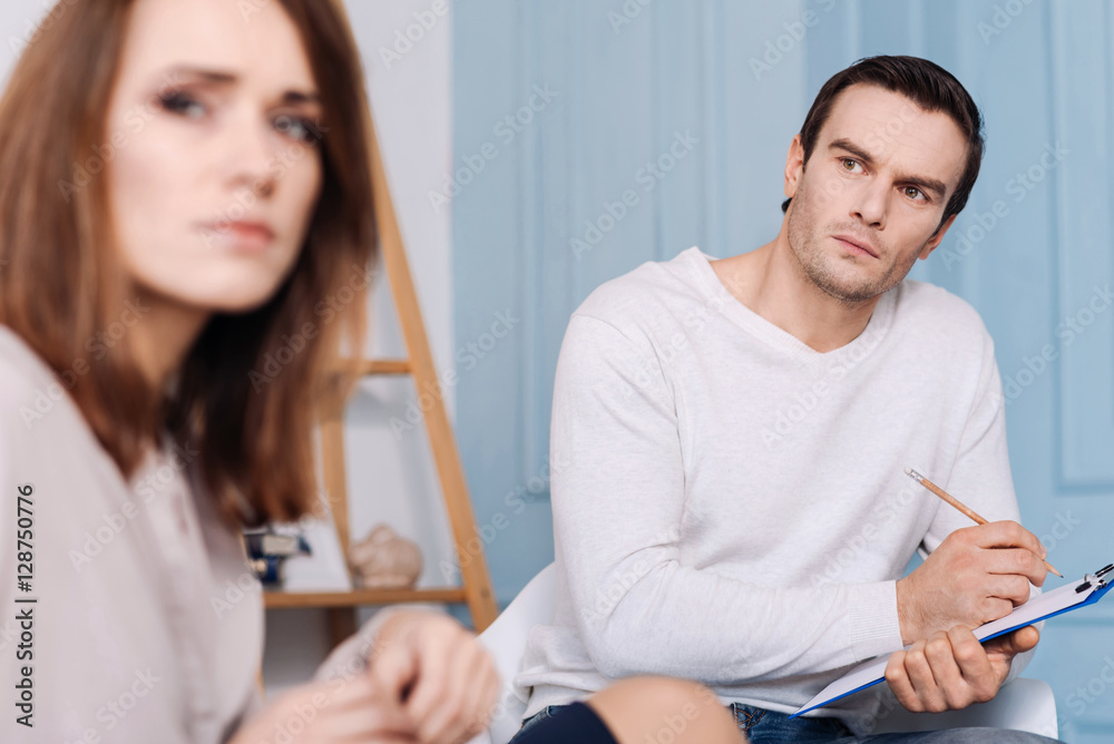 Professional psychologist consulting his client Professional psychologist consulting his client