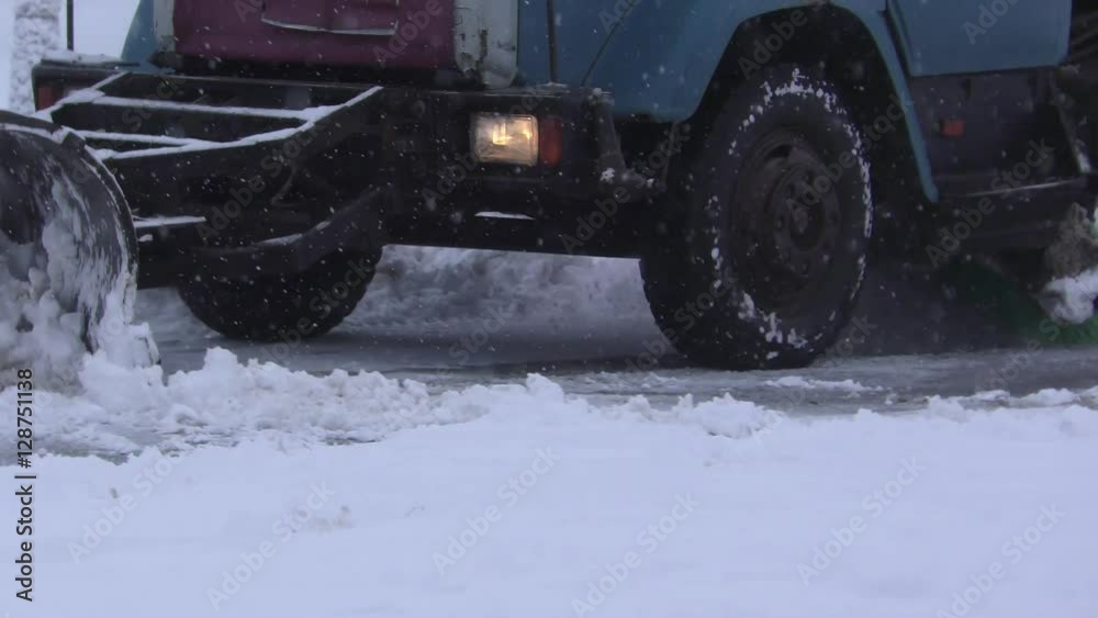 Snowplow cleans snow from the road Snowplow cleans snow from the road