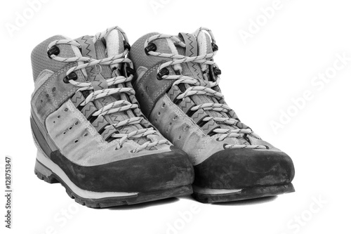 Old boots on white background, b/w tone
