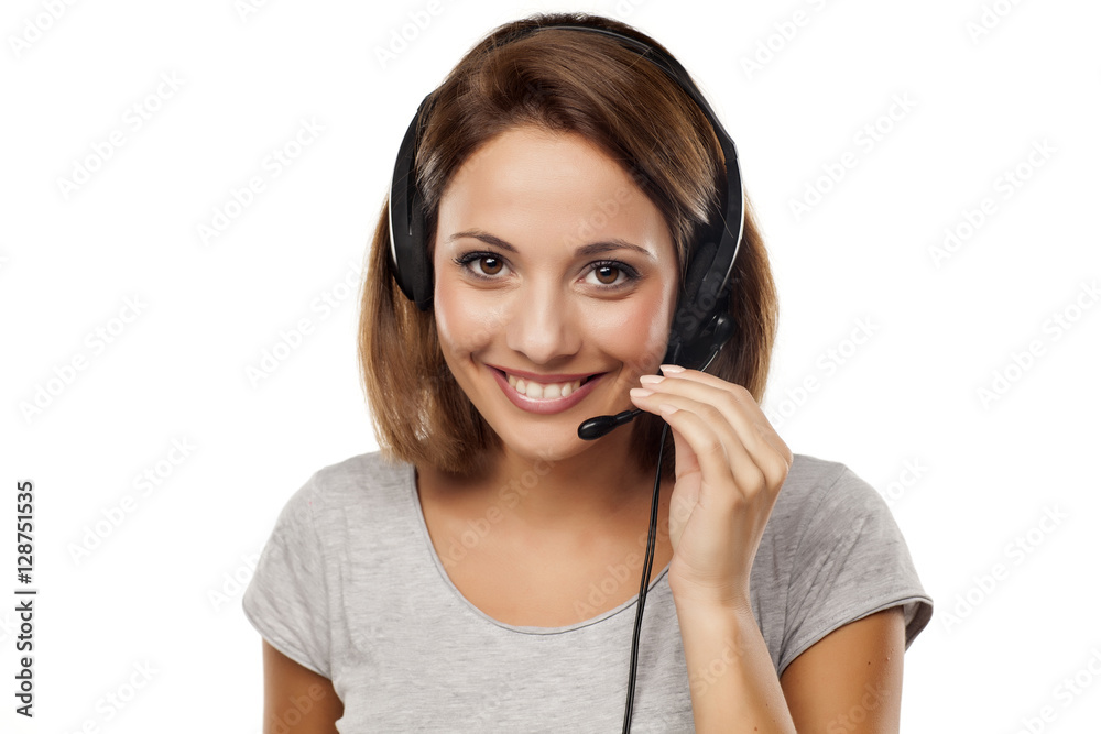 attractive young woman with headset on her head attractive young woman with headset on her head